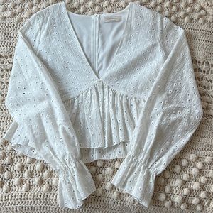 White long sleeve top with eyelet detailing from Saints and Hearts.